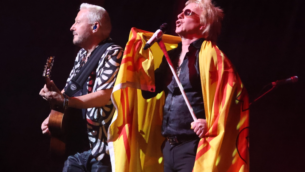 Some Guys Have All The Luck band performing on stage